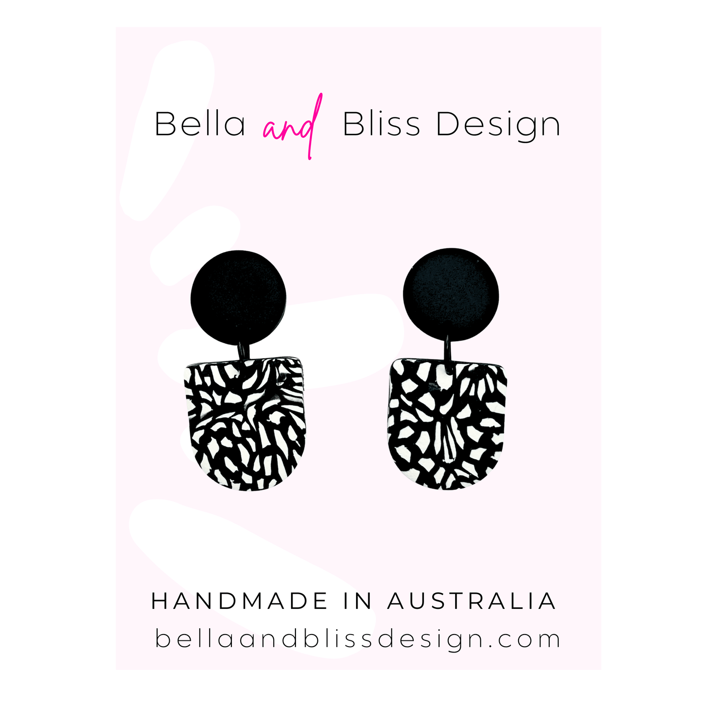 Black and white patterned earrings with 'Bella and Bliss Design' branding on a light pink background.