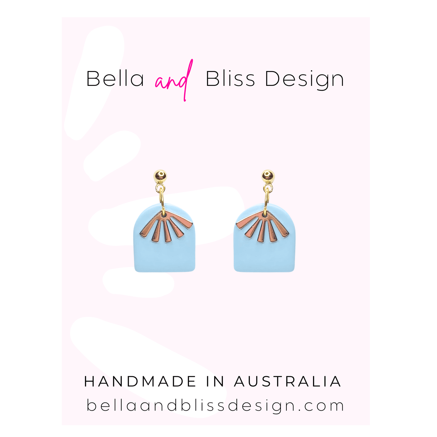 Pair of earrings with blue and gold design on a light pink background with Bella and Bliss Design branding.