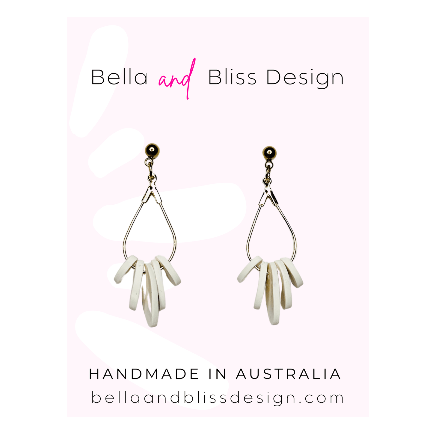 Pair of earrings with 'Bella and Bliss Design' branding on a light pink background.