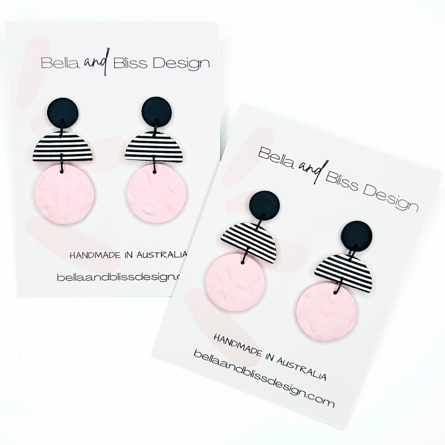 Earrings with pink and black design on a white background, featuring 'Bella and Bliss Design'.