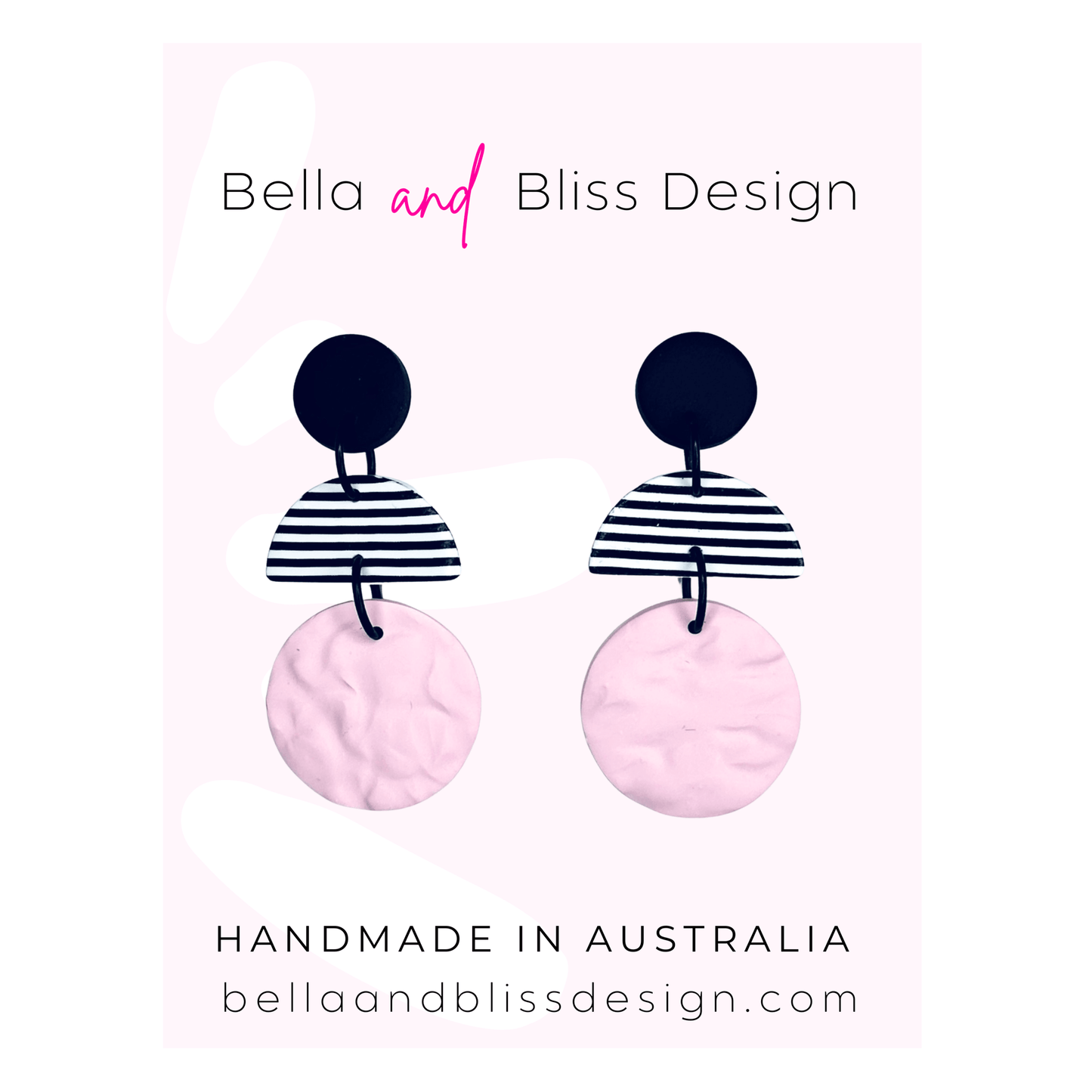 Earrings with black and white striped design on pink background, branded 'Bella and Bliss Design'.
