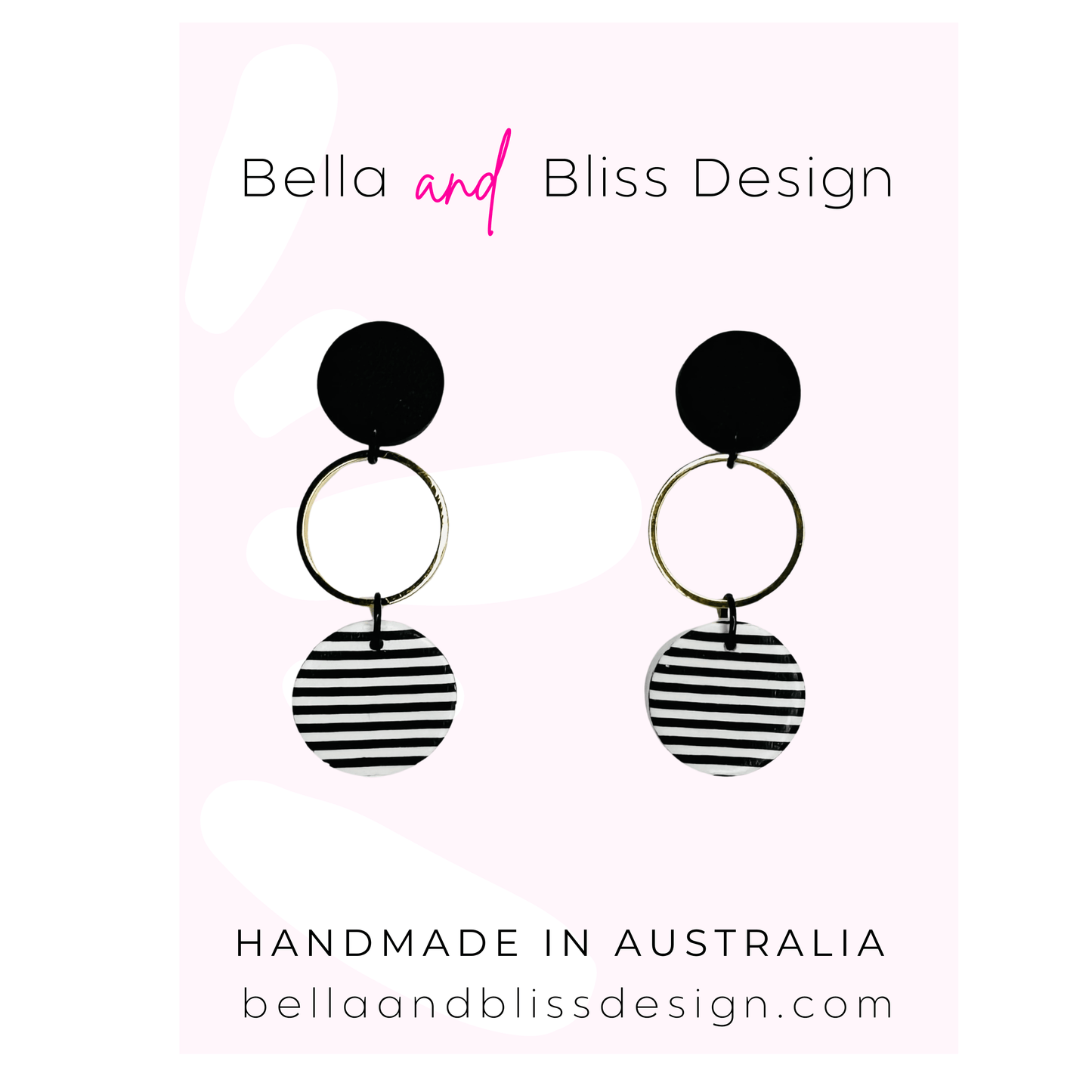 Black and white striped earrings with 'Bella and Bliss Design' branding on a light pink background.
