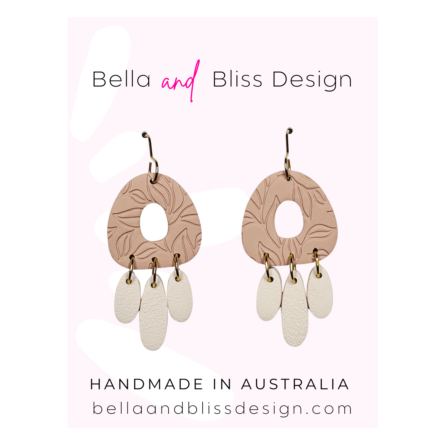 Pair of earrings with pink and beige design on a light pink background, featuring 'Bella and Bliss Design'.