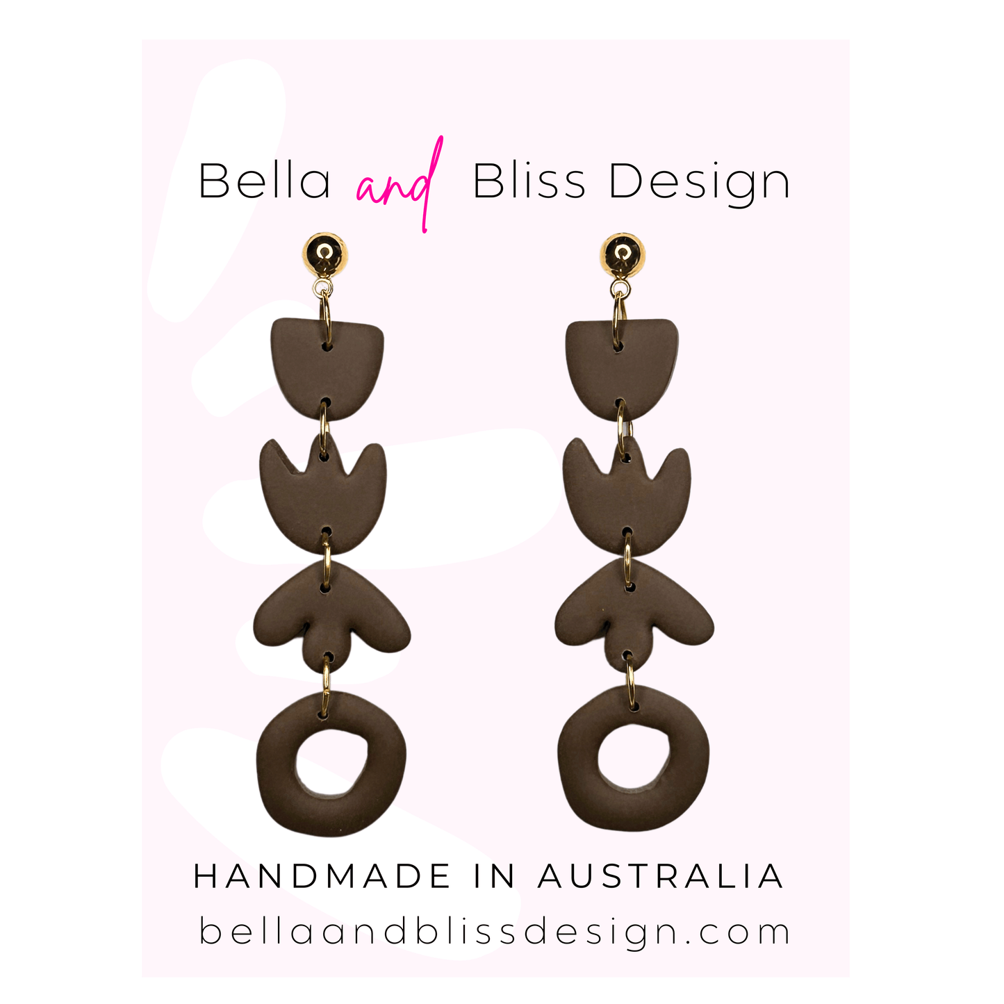 Brown dangle earrings with gold accents on a pink background, featuring 'Bella and Bliss Design'.