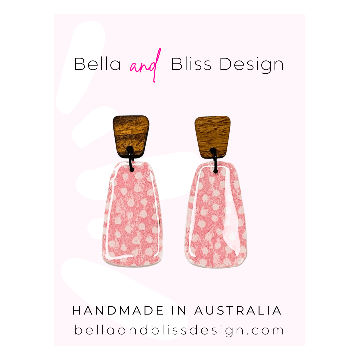 Pair of pink earrings with wooden tops on a white background, branded as Bella and Bliss Design.