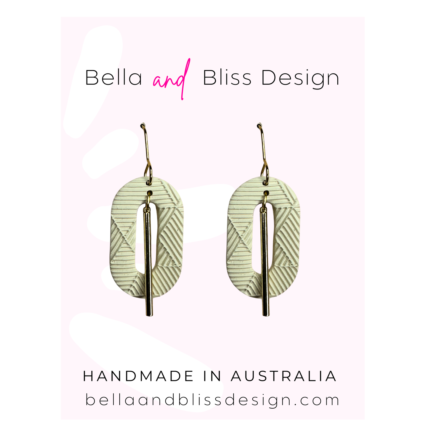 Pair of earrings with 'Bella and Bliss Design' branding on a light pink background.