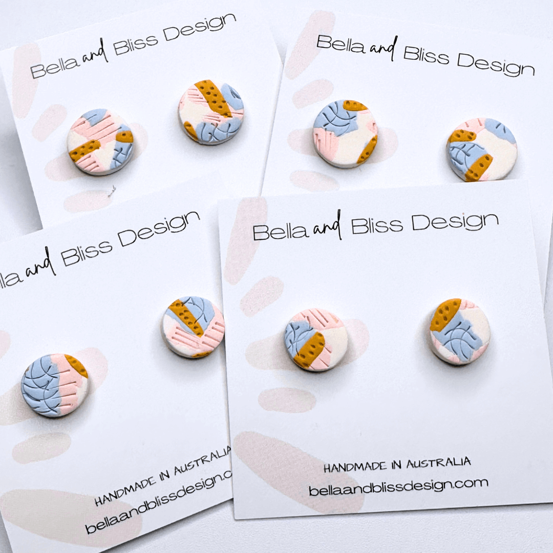 Bella and Bliss Design earrings on branded cards with a white background