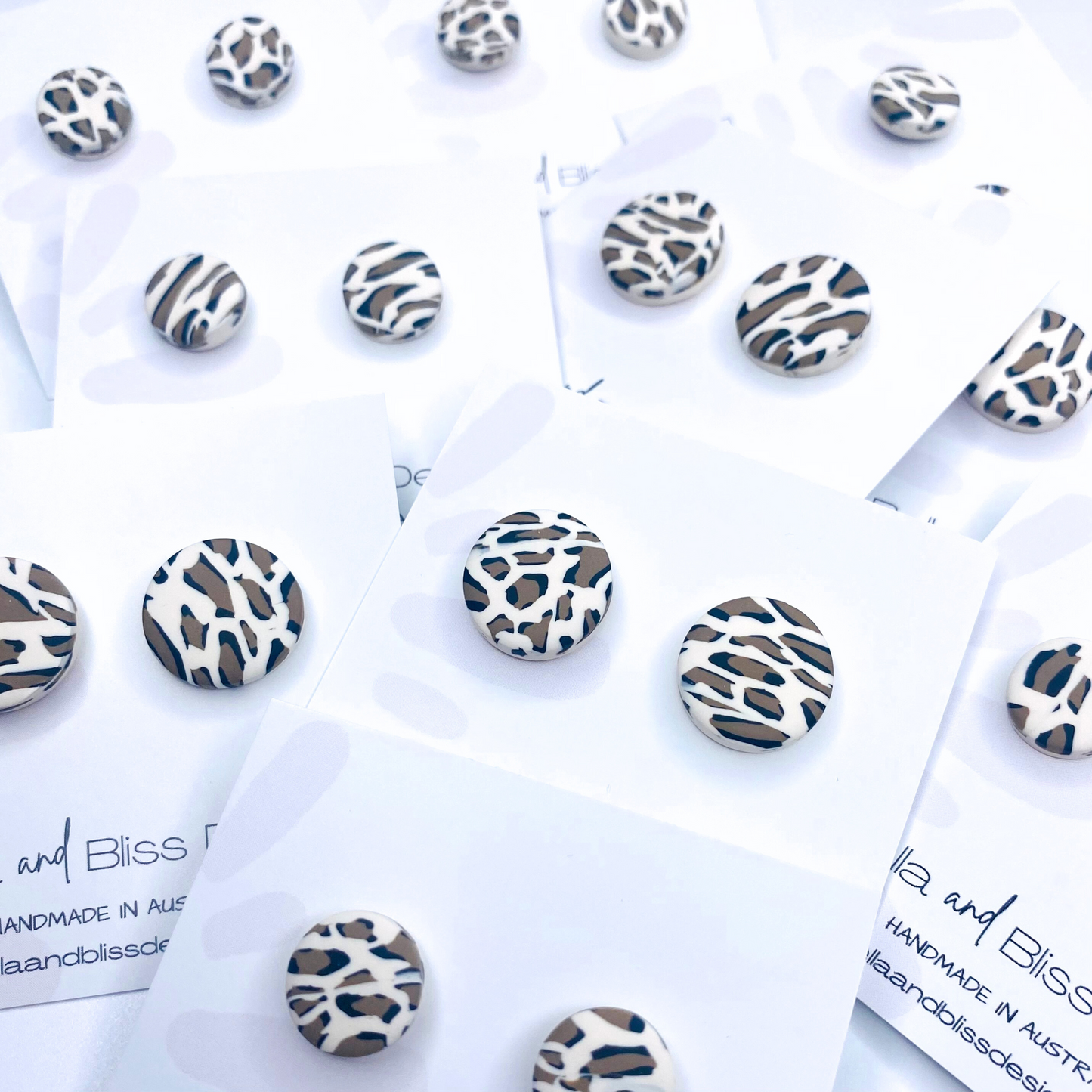 White leopard print earrings