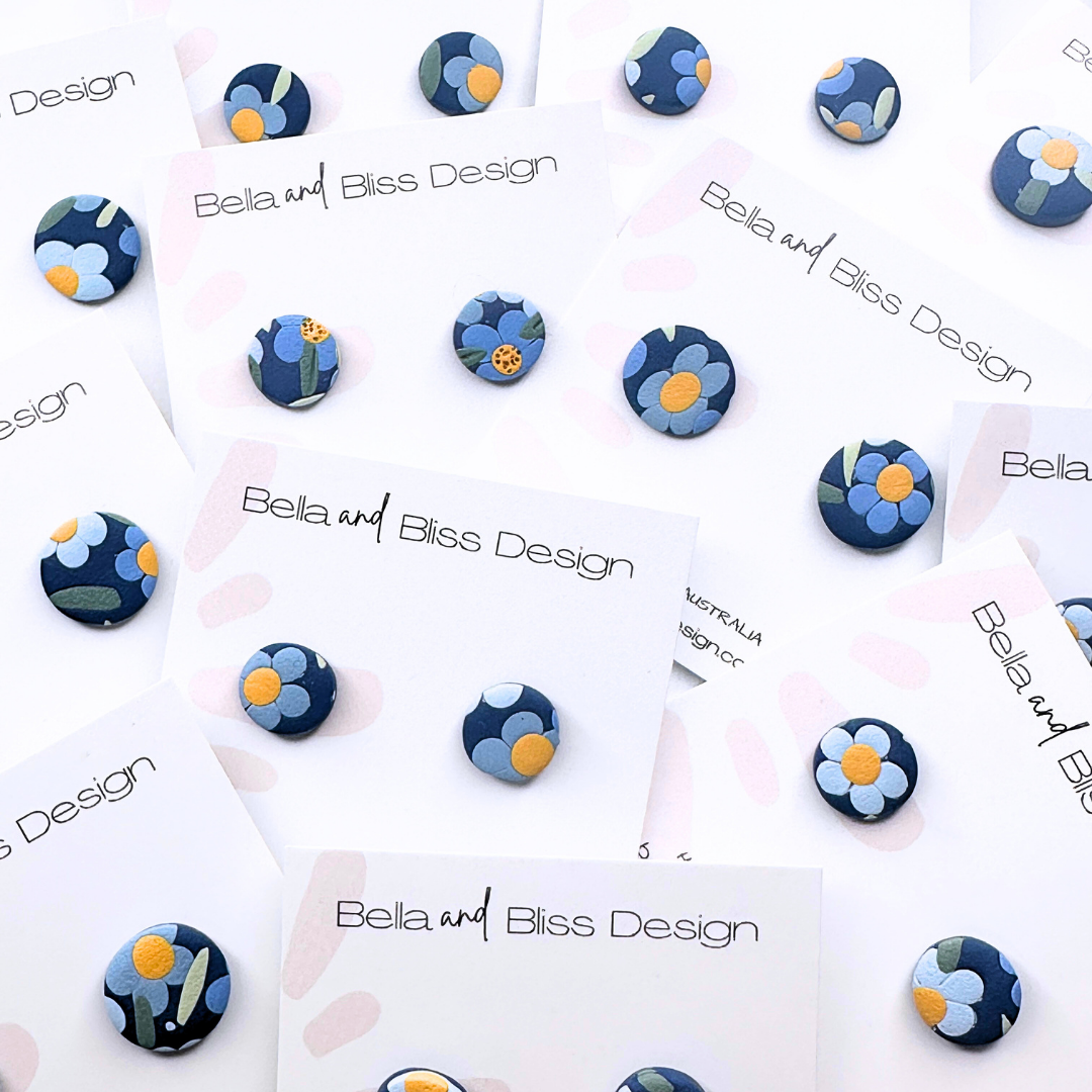 Set of blue and white patterned earrings on Bella and Bliss Design cards.