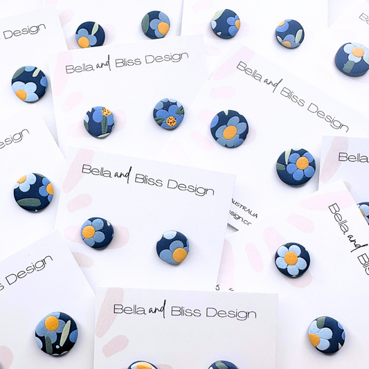 Set of blue and white patterned earrings on Bella and Bliss Design cards.