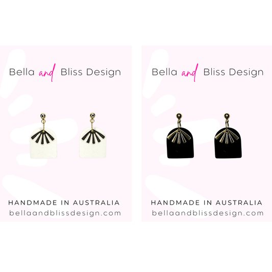 Pair of earrings with 'Bella and Bliss Design' branding on a white background.