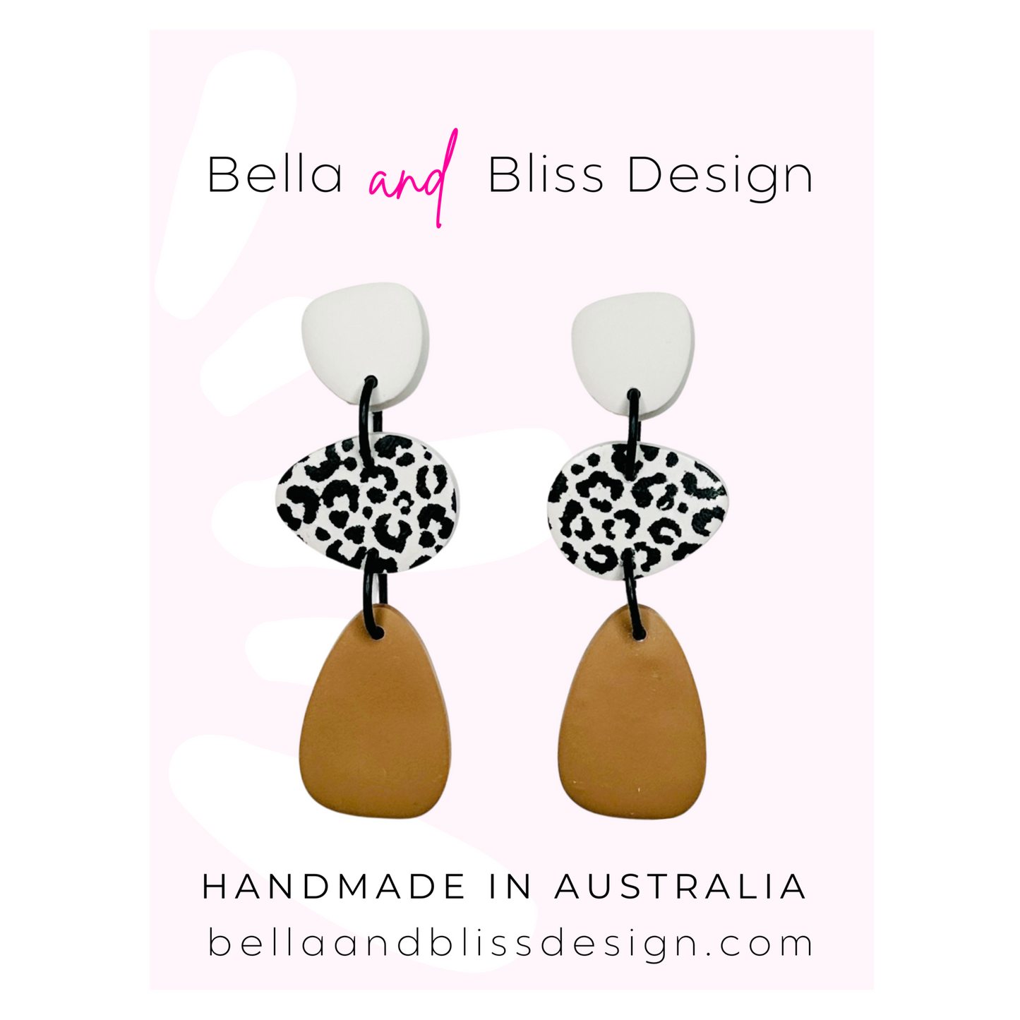 Pair of earrings with leopard print and brown design on a white background with Bella and Bliss Design branding.