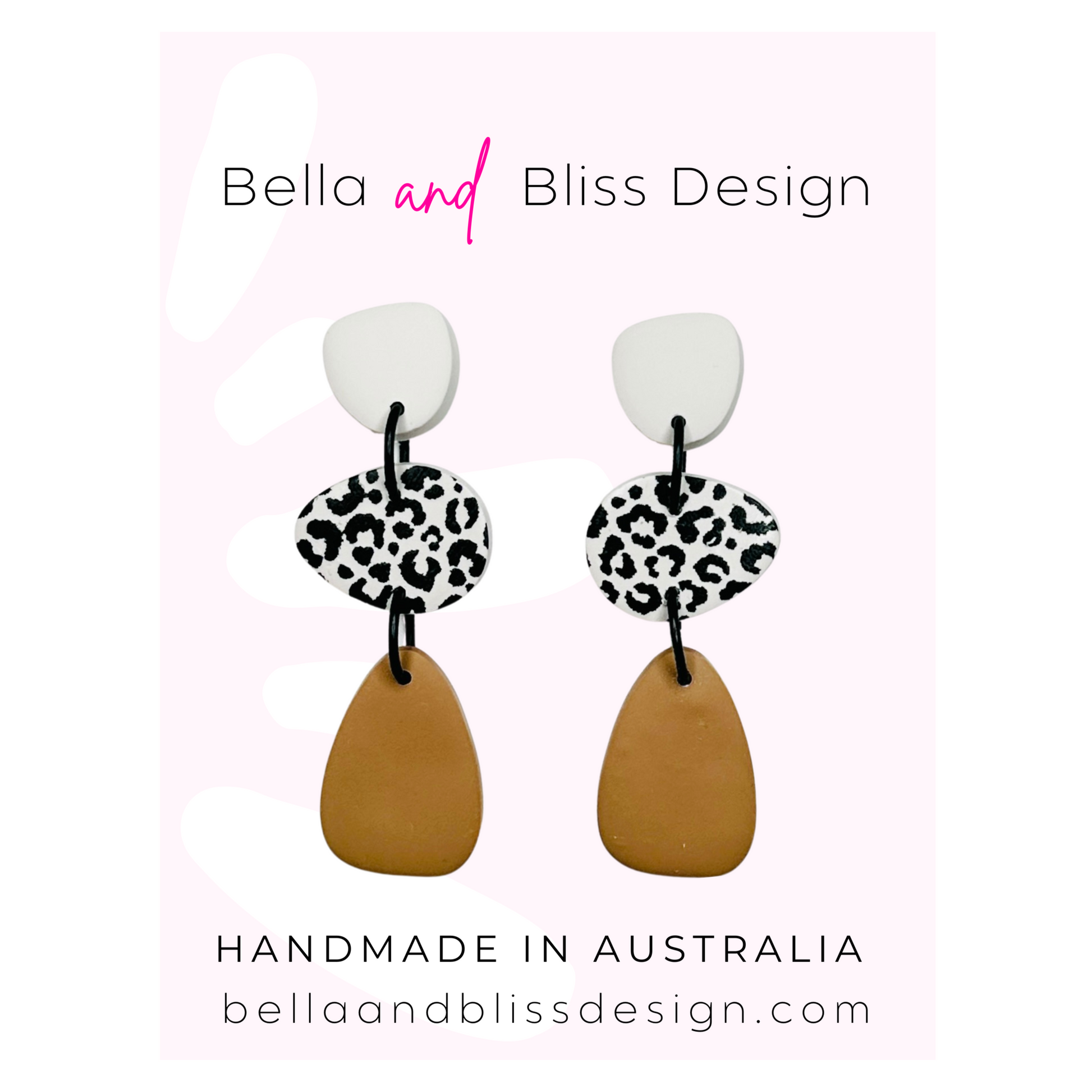 Pair of earrings with leopard print and brown design on a white background with Bella and Bliss Design branding.