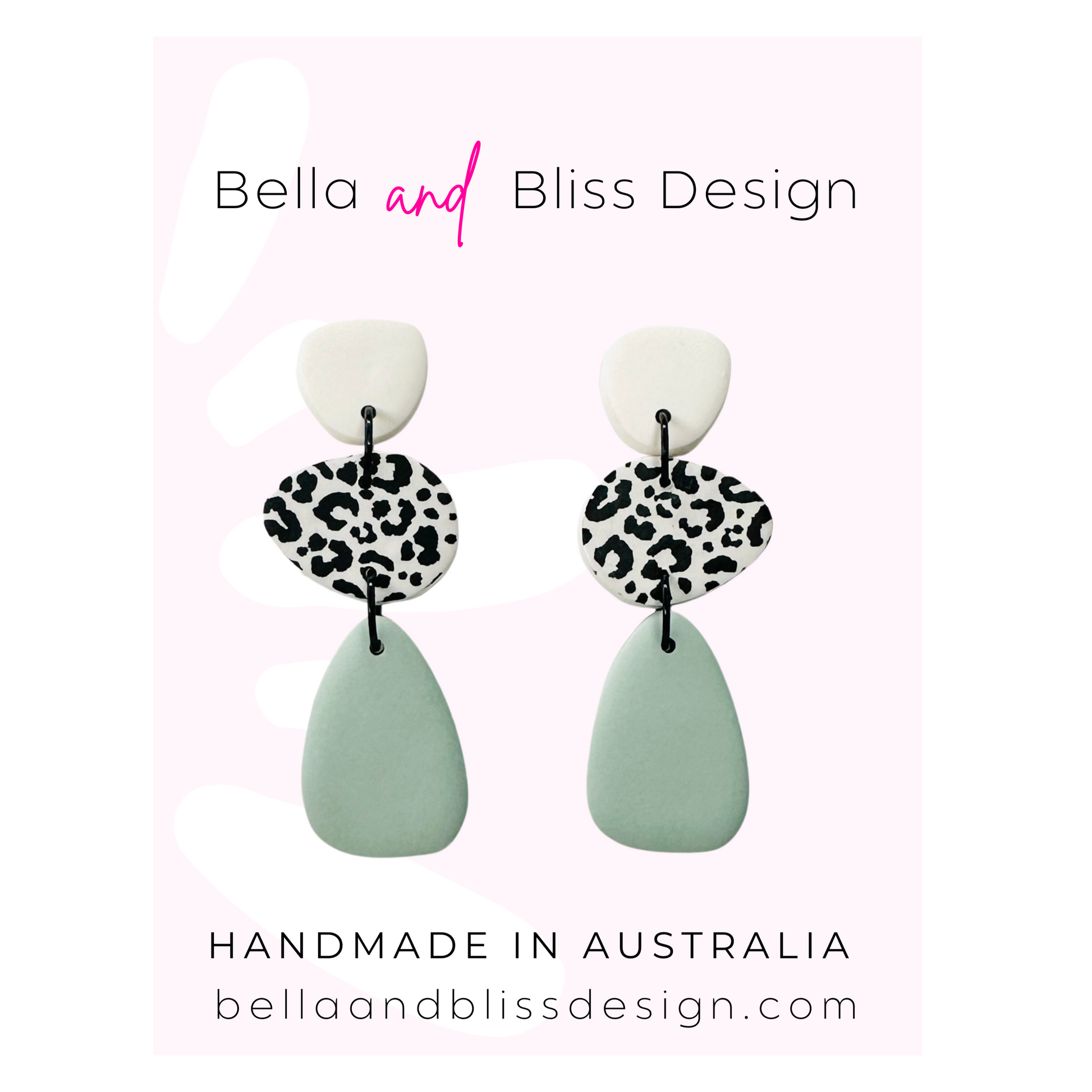 Earrings with leopard print and light green design on a white background with Bella and Bliss Design branding.