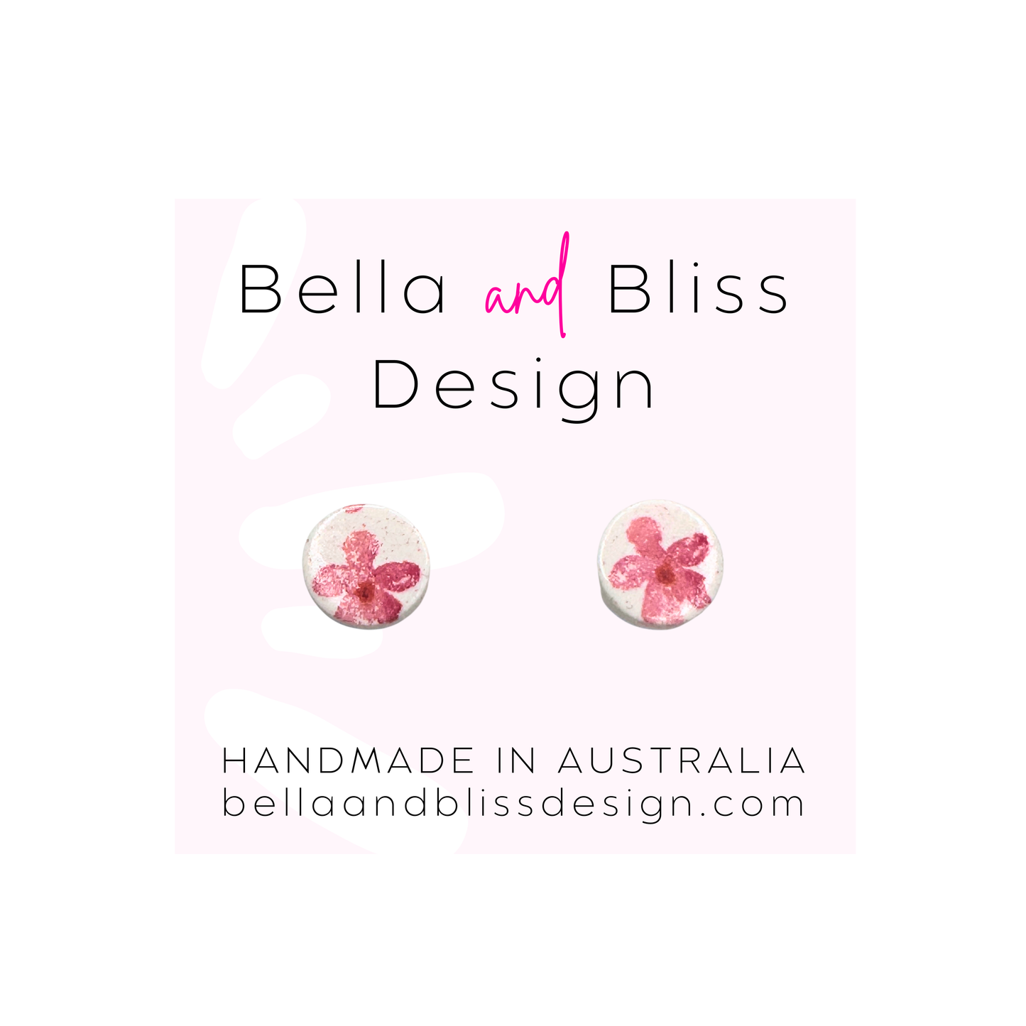 Flower print earrings with 'Bella and Bliss Design' branding on a light pink background.