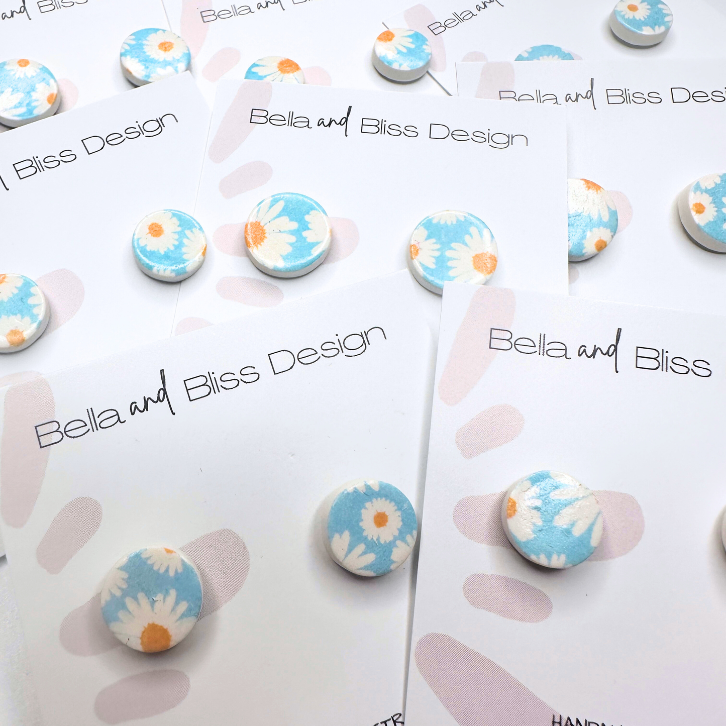 Floral blue earrings on a Bella and Bliss Design card