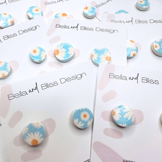 Floral blue earrings on a Bella and Bliss Design card