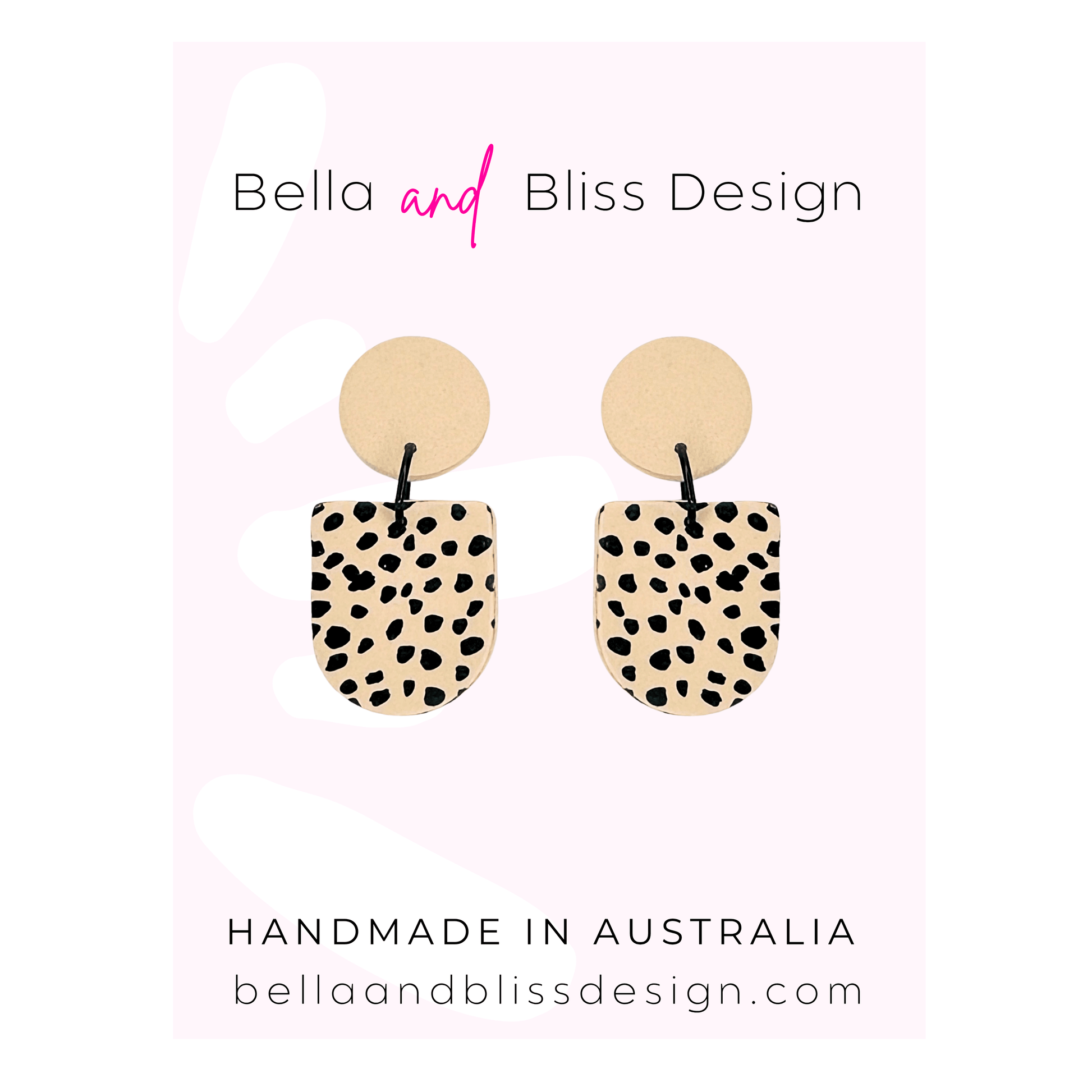 Pair of earrings with spotted design on a pink background with Bella and Bliss Design branding.