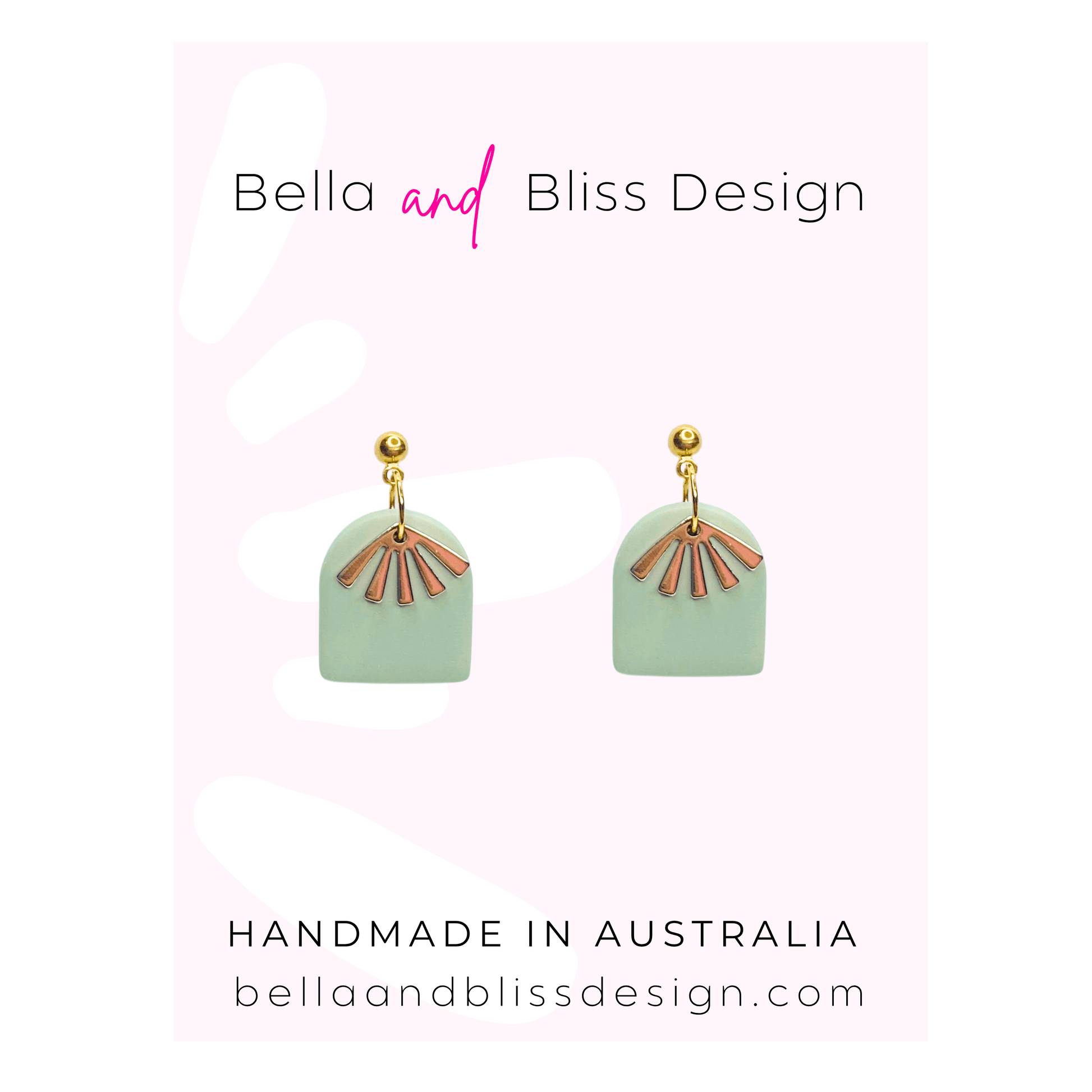 Pair of earrings with gold accents on a light pink background, featuring Bella and Bliss Design branding.