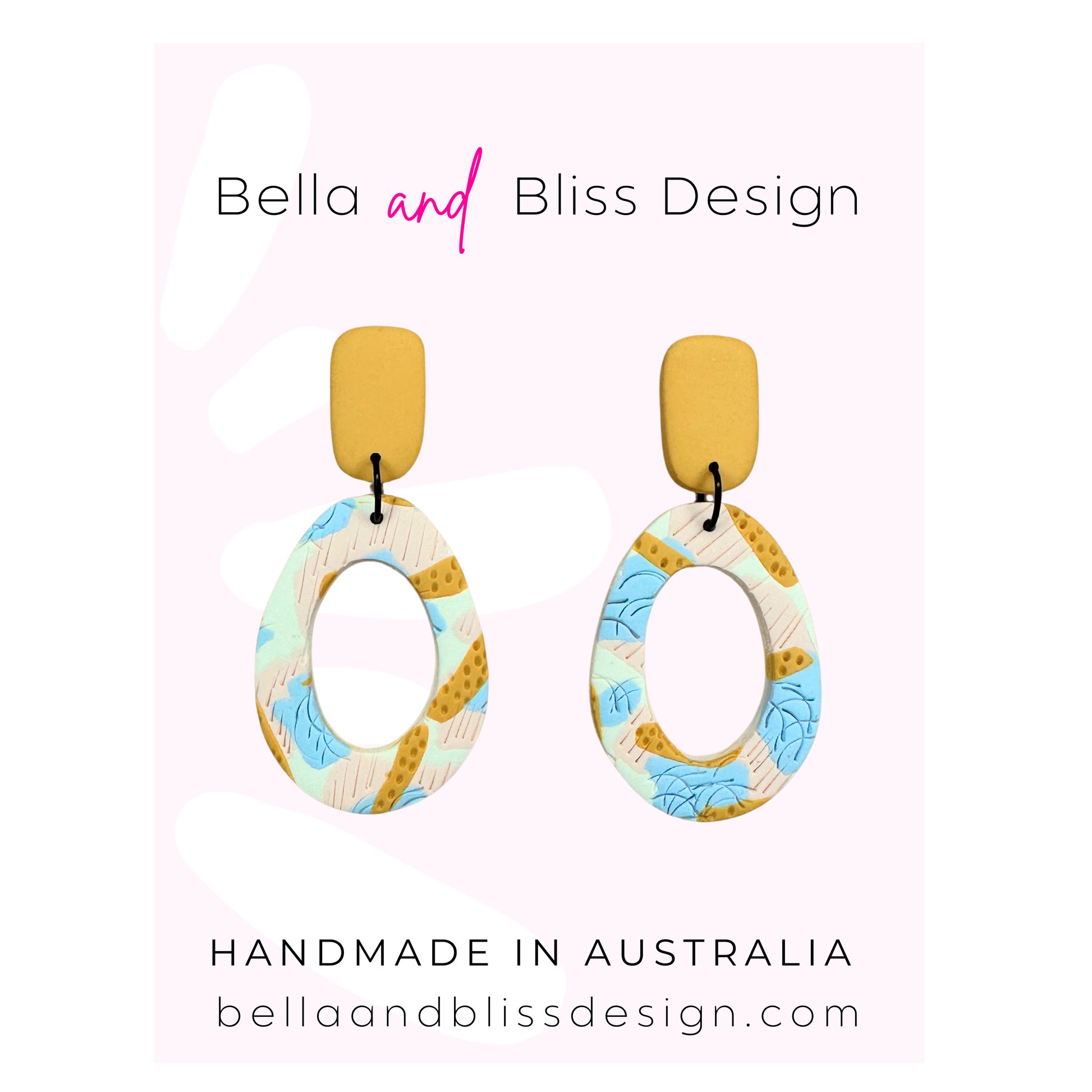 Colorful earrings with 'Bella and Bliss Design' branding on a light pink background.