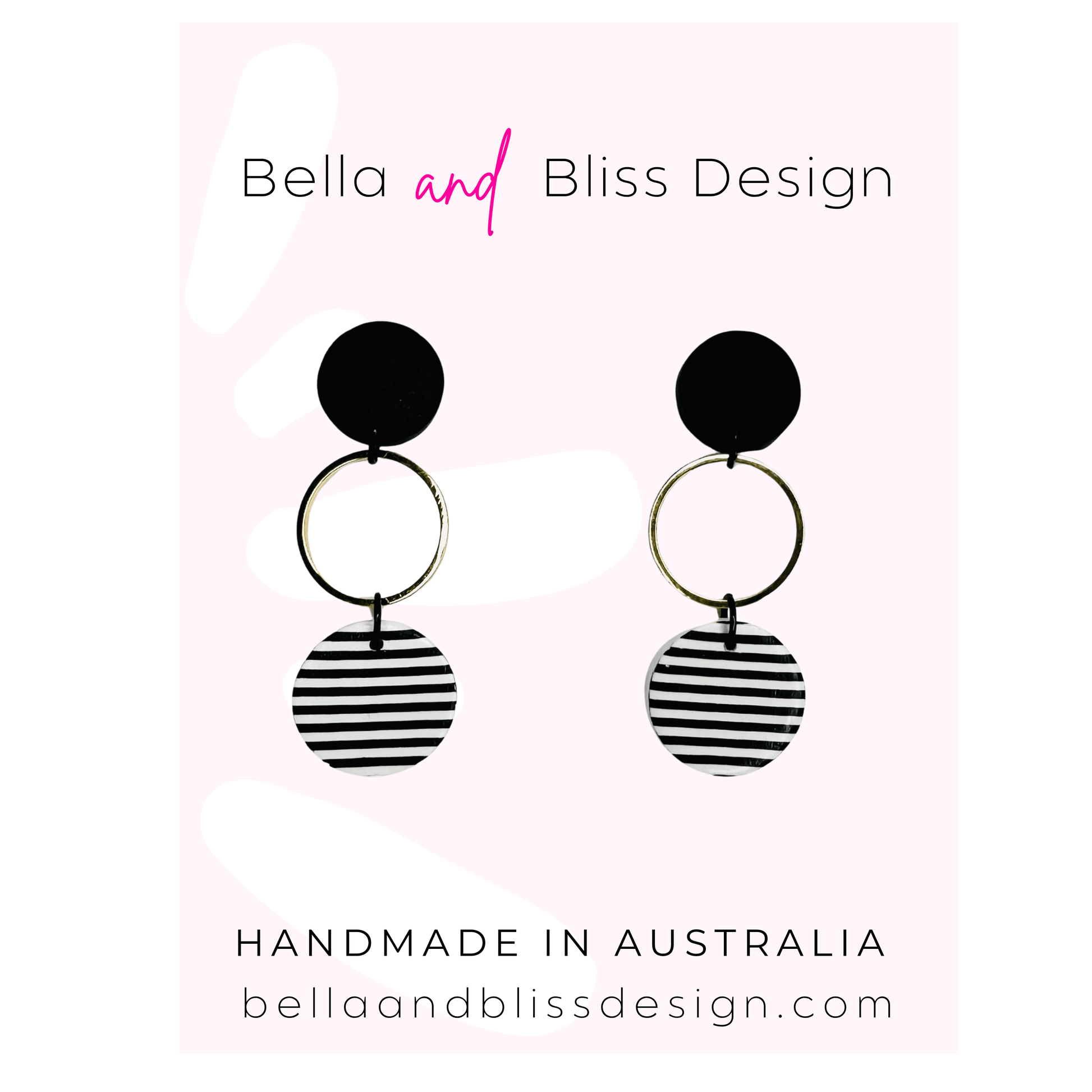 Black and white striped earrings with 'Bella and Bliss Design' branding on a light pink background.