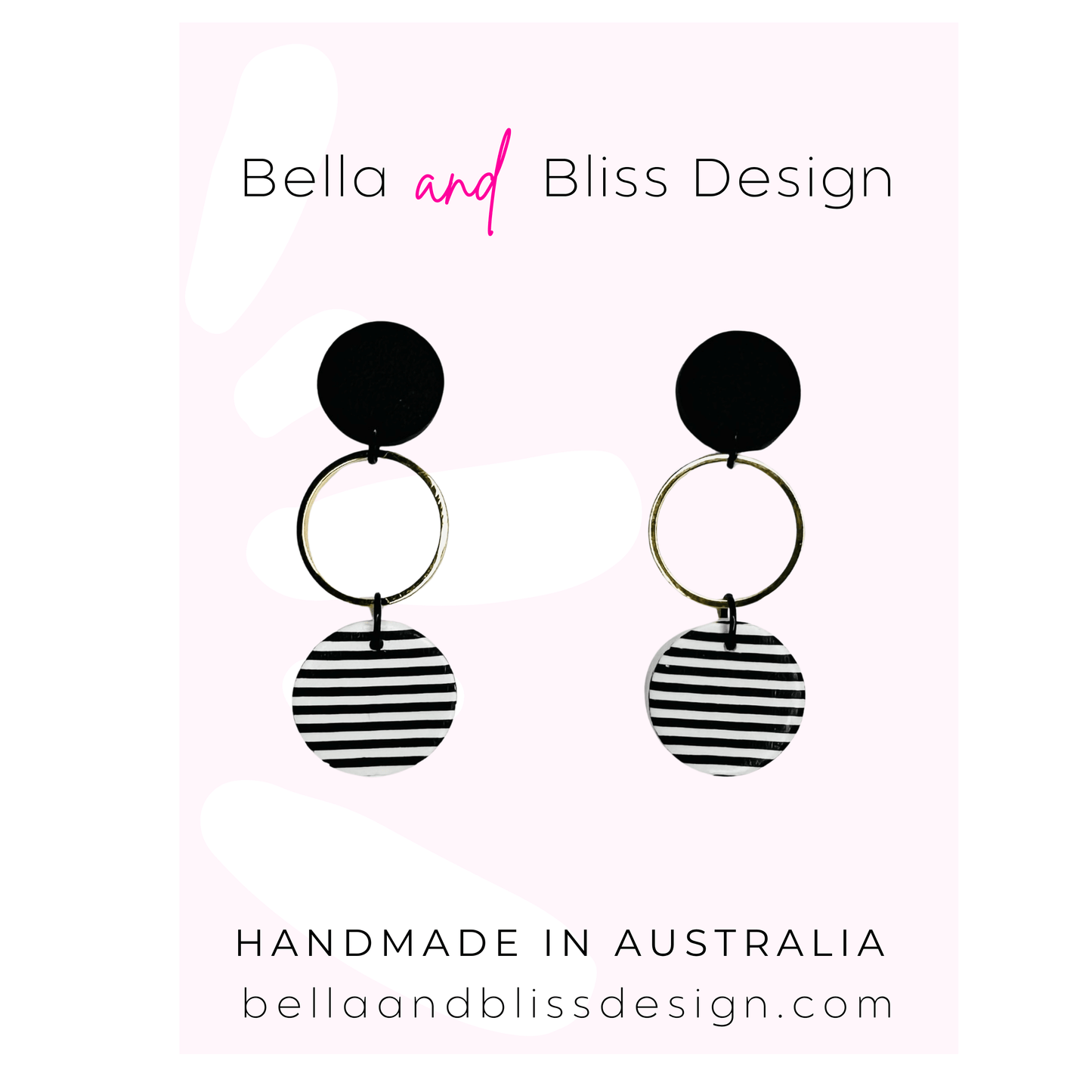 Black and white striped earrings with 'Bella and Bliss Design' branding on a light pink background.