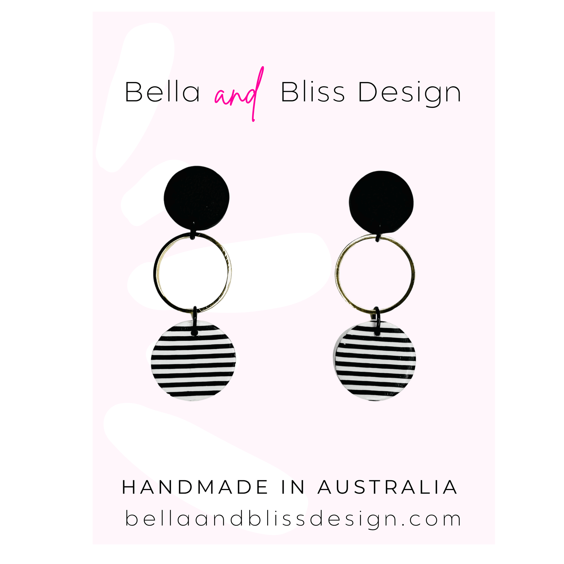Black and white striped earrings with 'Bella and Bliss Design' branding on a light pink background.