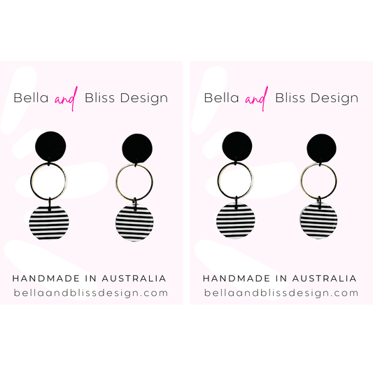 Black and white striped earrings with 'Bella and Bliss Design' branding on a white background.