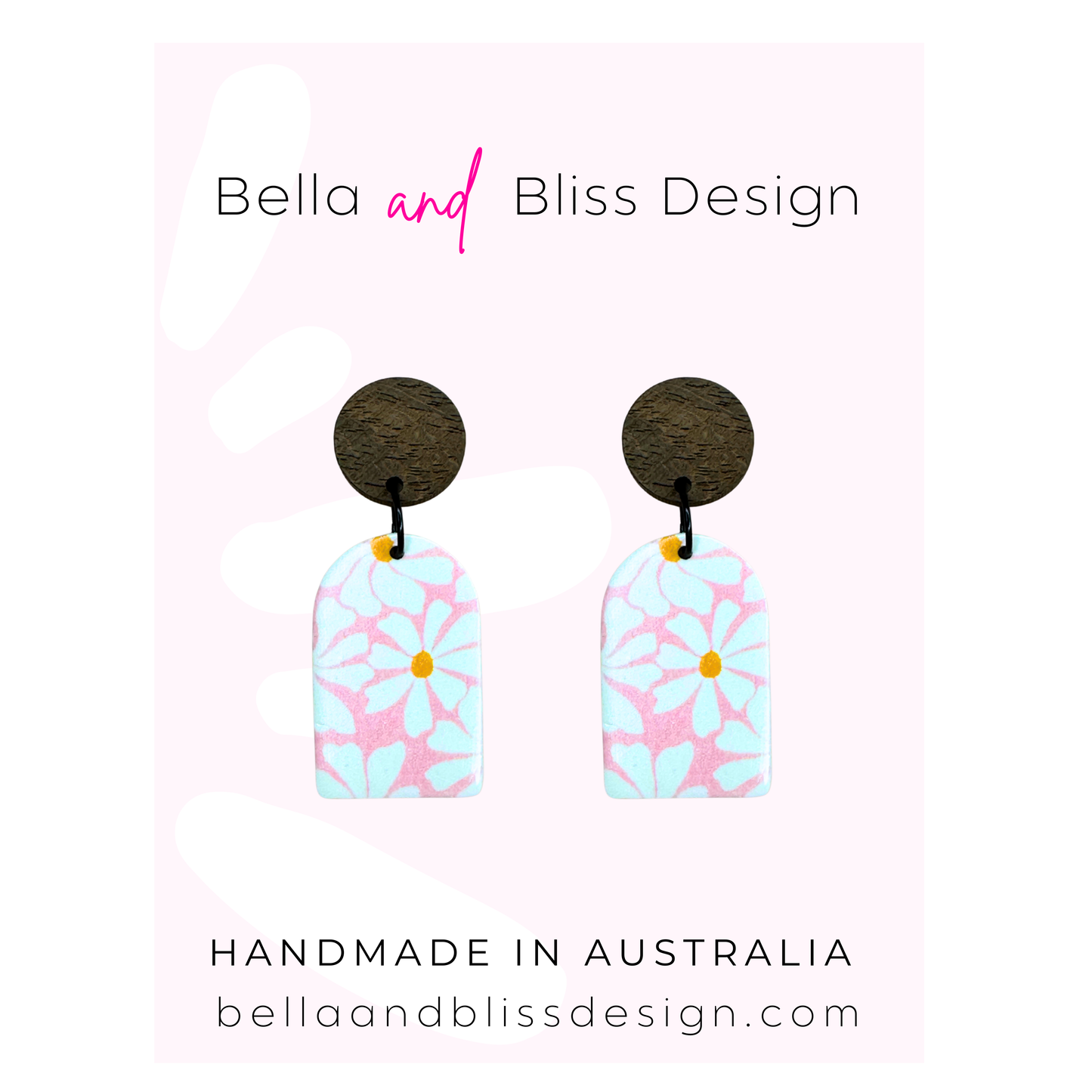 Earrings with floral design on a pink background, branded as Bella and Bliss Design.