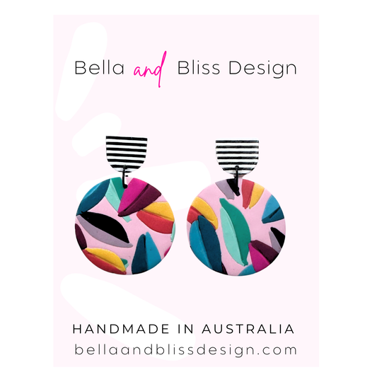 Colourful earrings on a card with 'Bella and Bliss Design' branding.