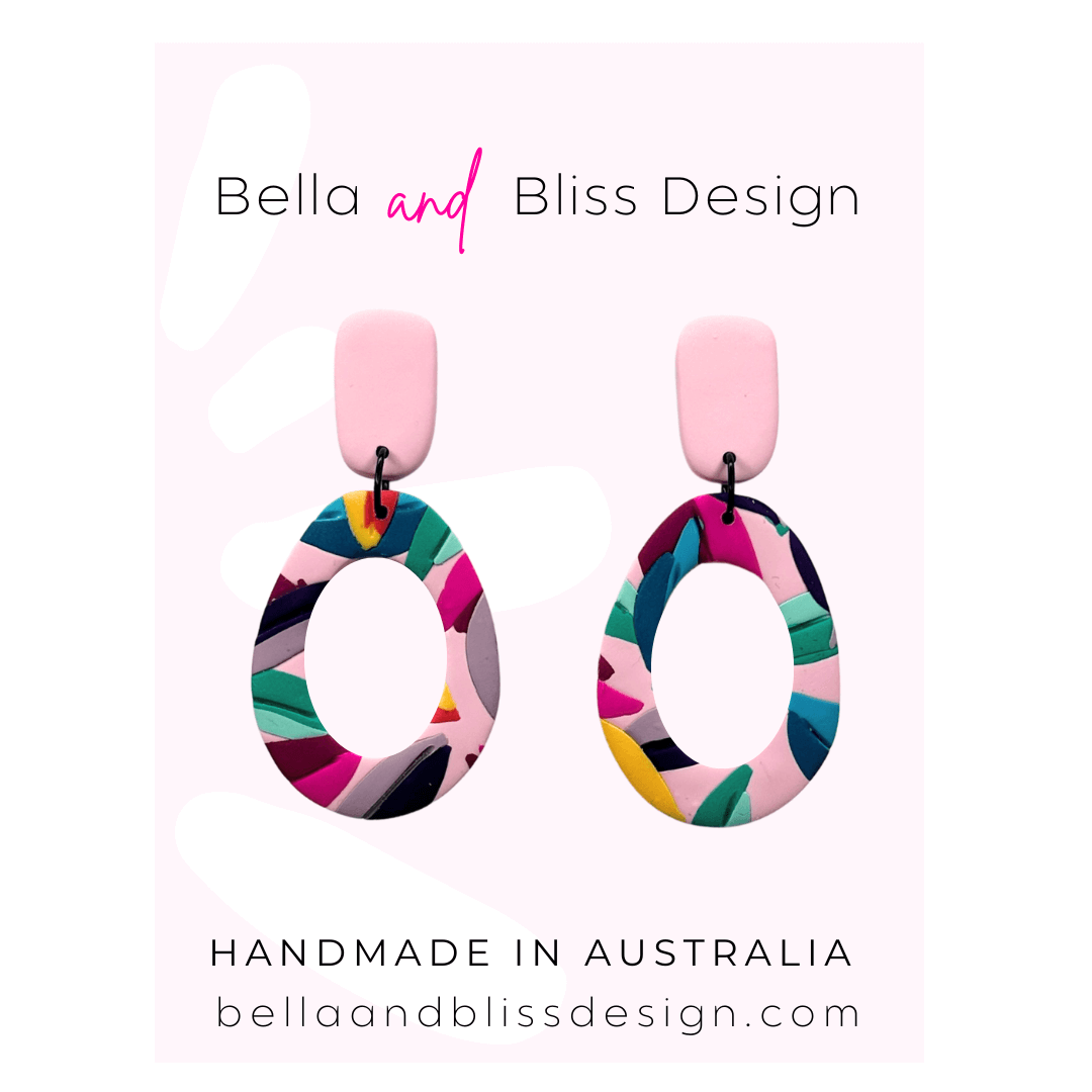Colourful earrings on a card with 'Bella and Bliss Design' branding.