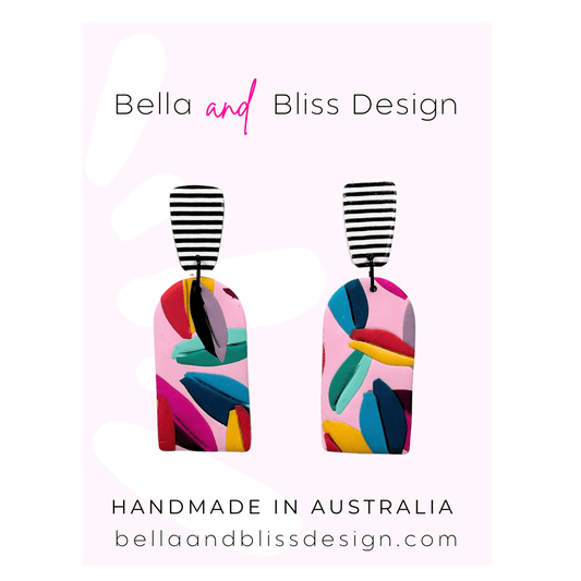 Colourful earrings on a card with 'Bella and Bliss Design' branding.