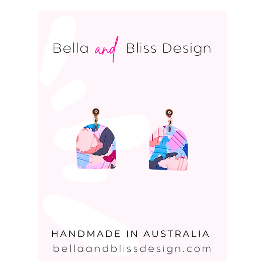 Earrings with different colour options  pink, blue, purple on a white background, branded as Bella and Bliss Design.