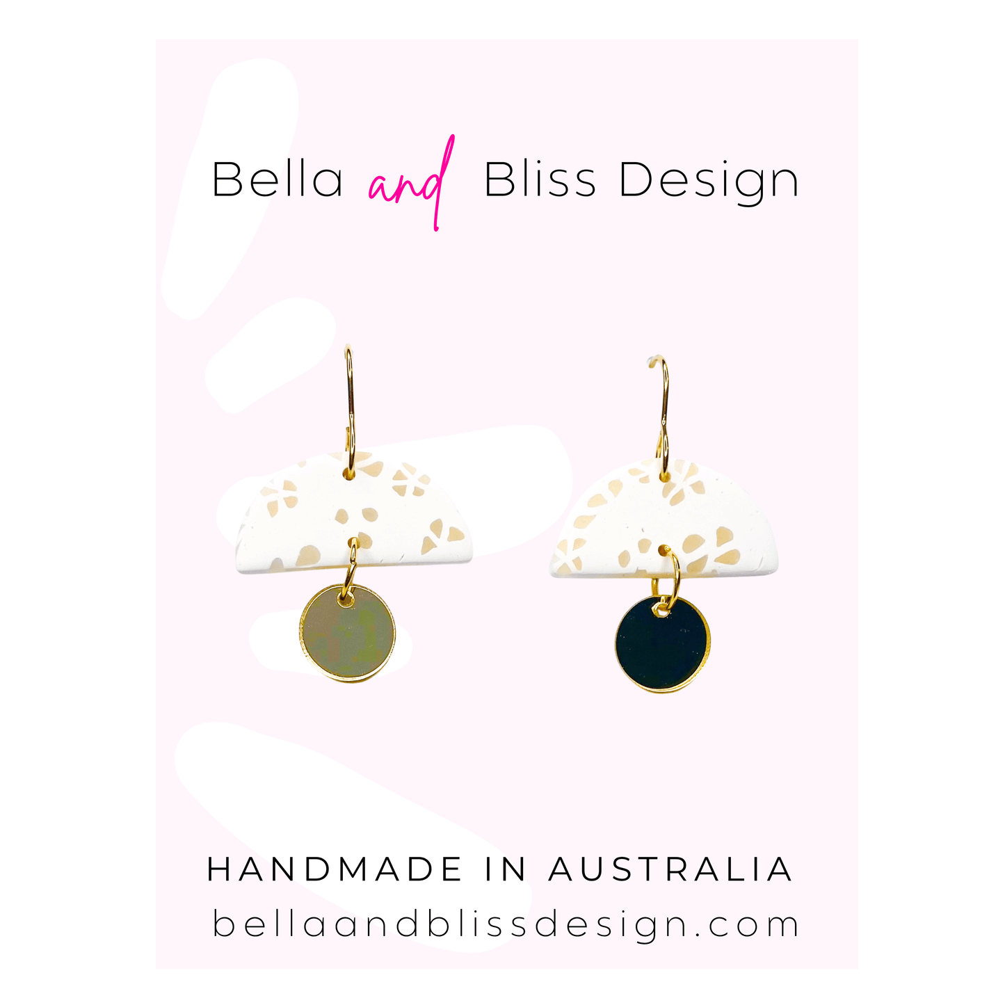 Pair of earrings with gold and black disc designs on a white card with Bella and Bliss Design branding.