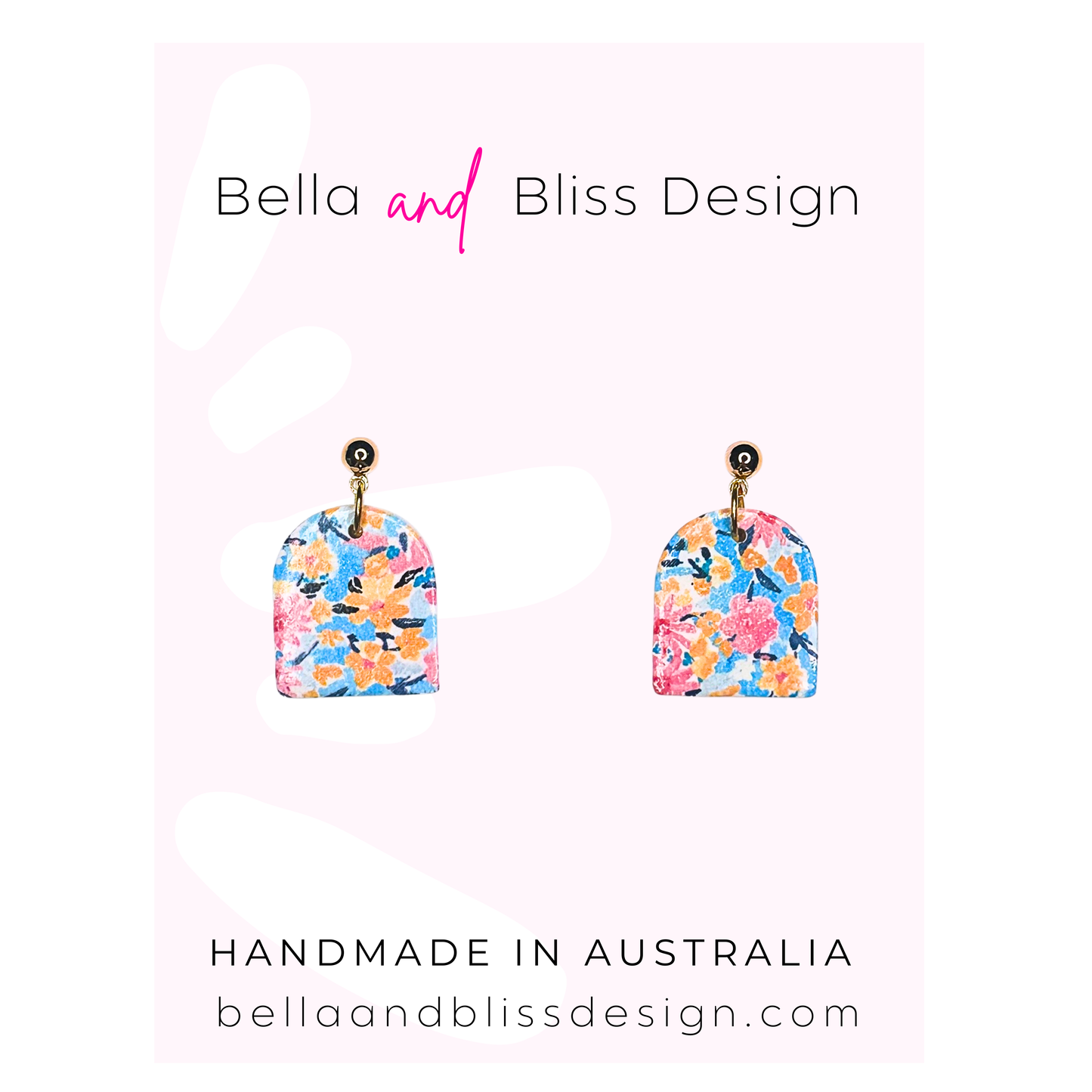 Pair of floral earrings with 'Bella and Bliss Design' branding on a light pink background.