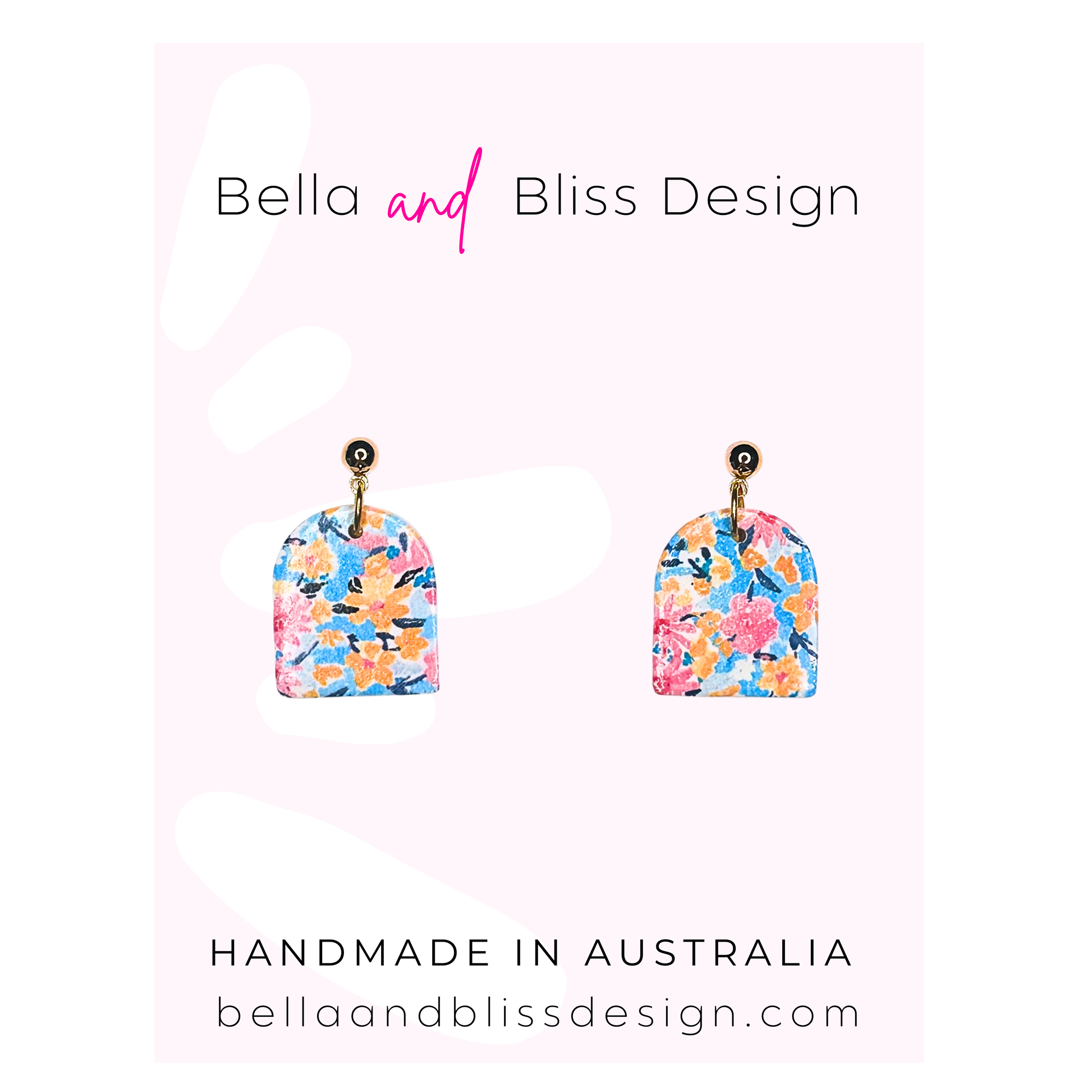 Pair of floral earrings with 'Bella and Bliss Design' branding on a light pink background.