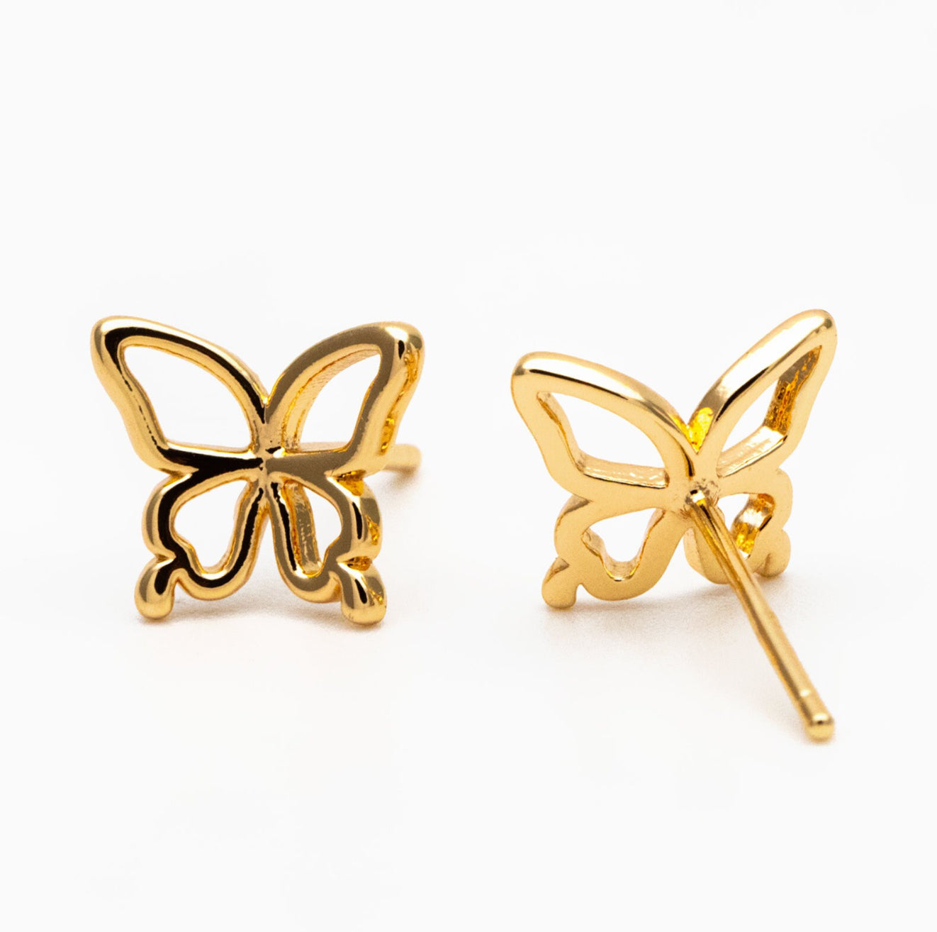 A pair of gold-coloured mini stud earrings in the shape of butterflies, 