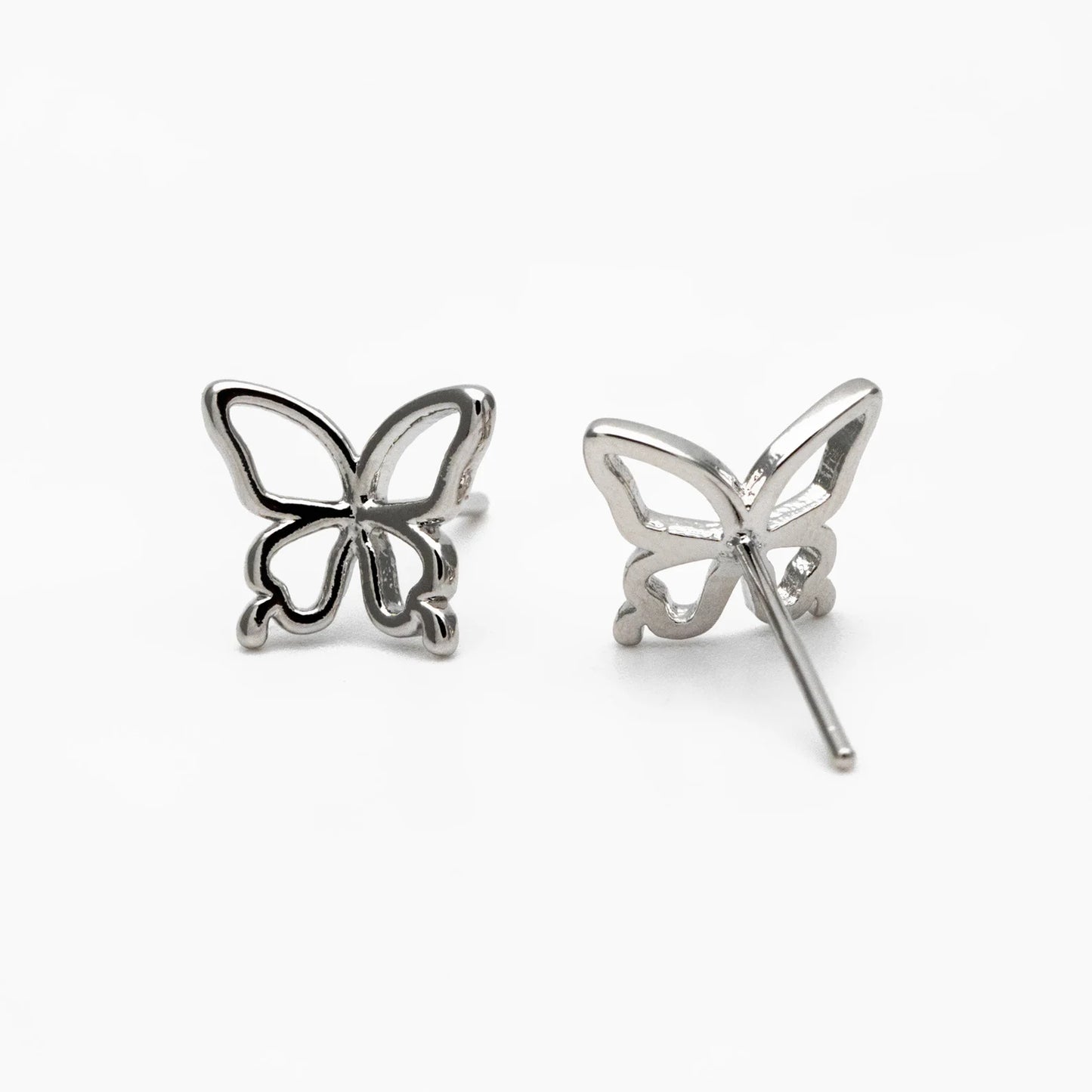 Butterfly-shaped silver earrings on a white background