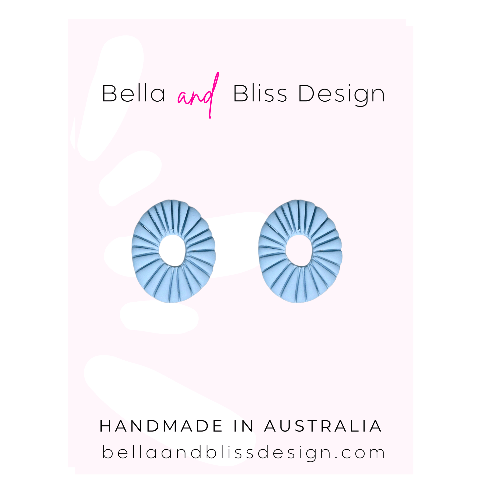 Blue circular earrings on a gradient pink to white background with Bella and Bliss Design branding.