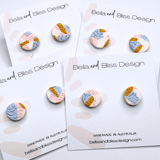 Bella and Bliss Design earrings on branded cards with a white background