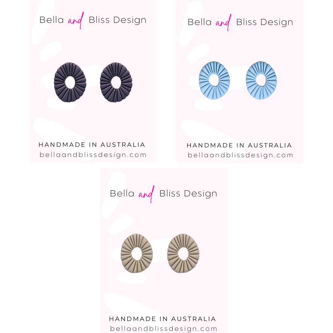 Earring display with Bella and Bliss Design branding on a white background