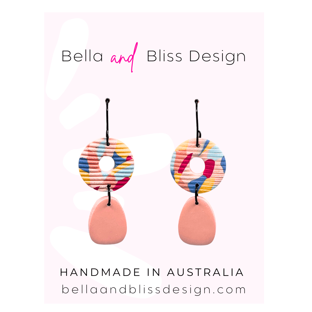 Colorful earrings on a white background with 'Bella and Bliss Design' branding.