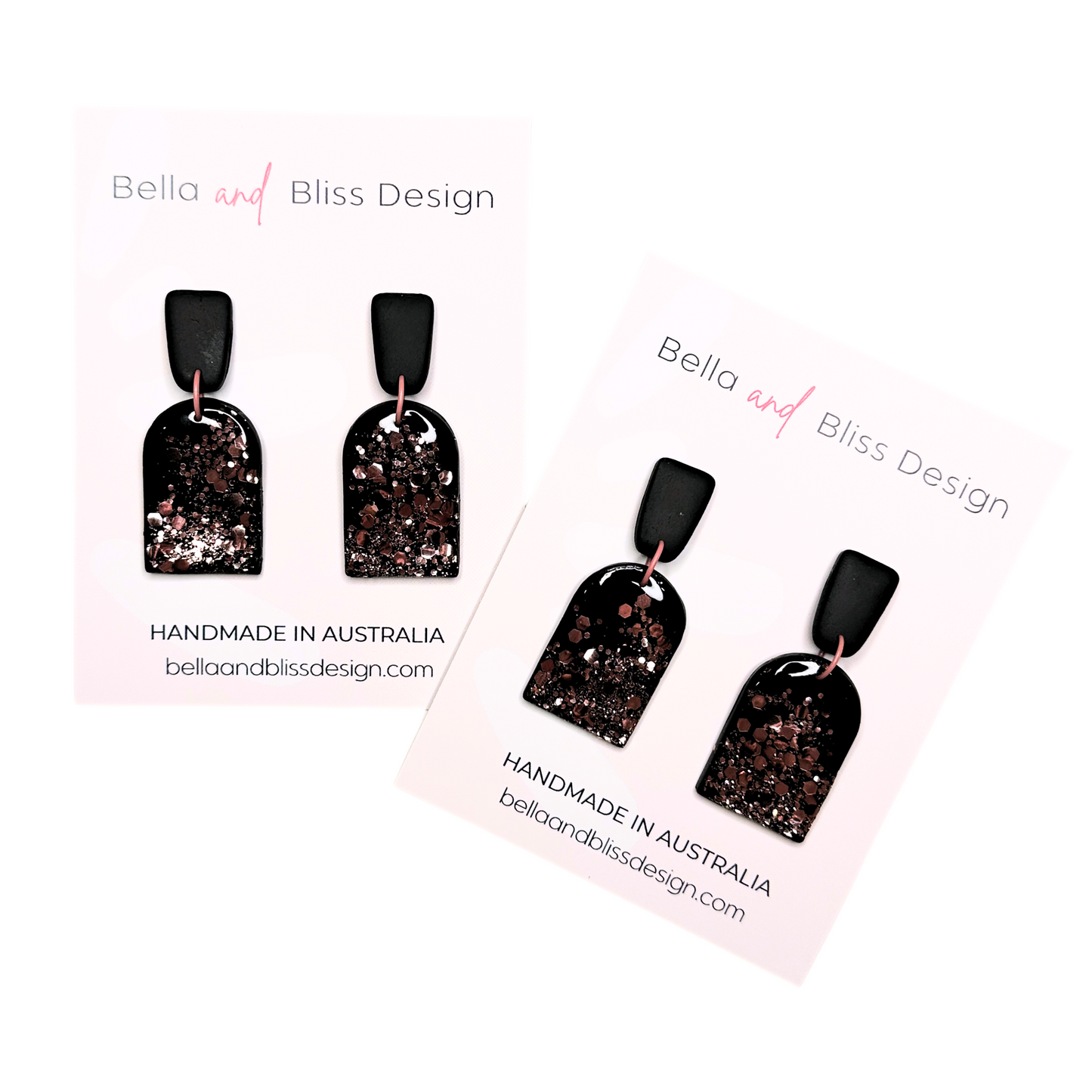 Black earrings with pink glitter  featuring Bella and Bliss Design branding.