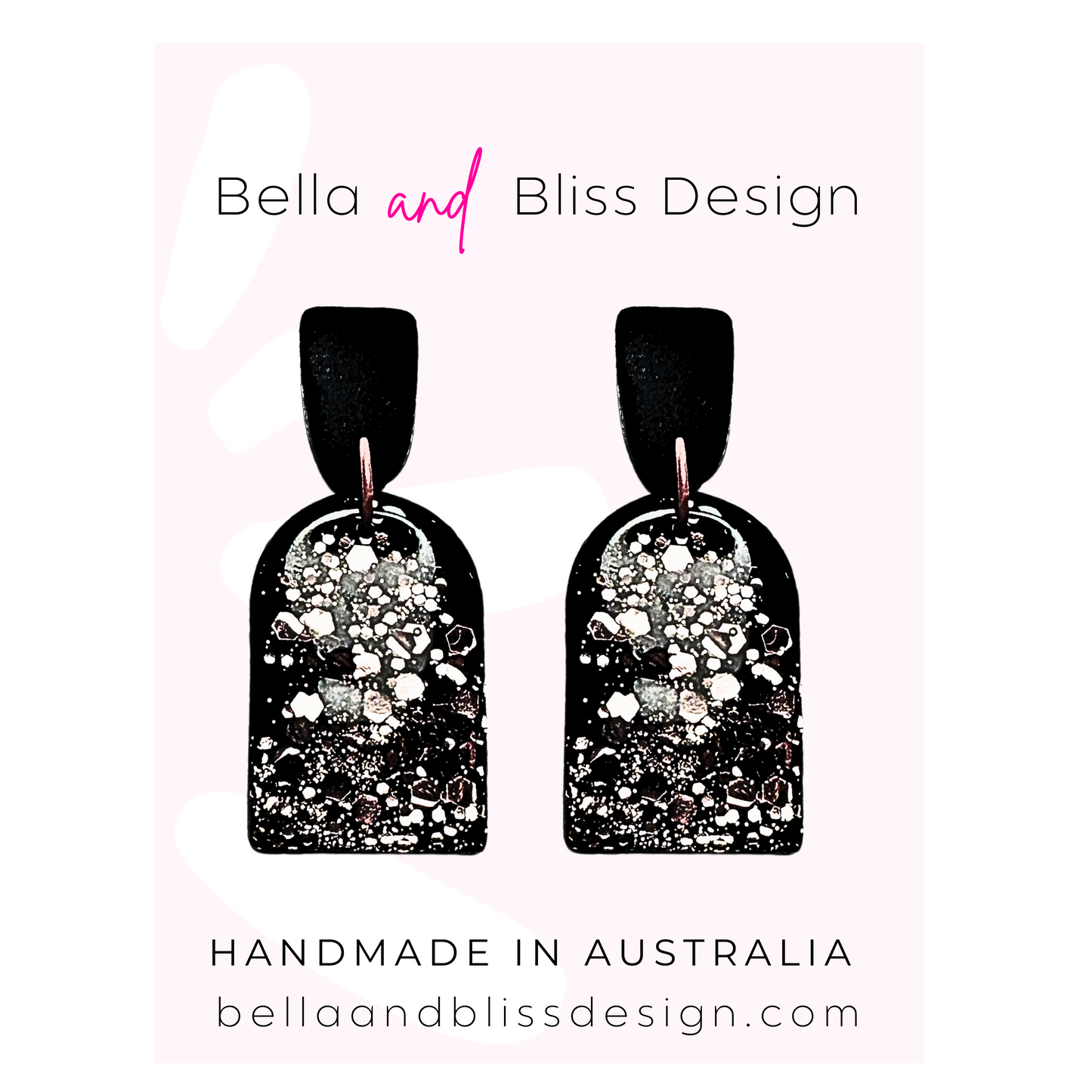 Black earrings with pink glitter  featuring Bella and Bliss Design branding.