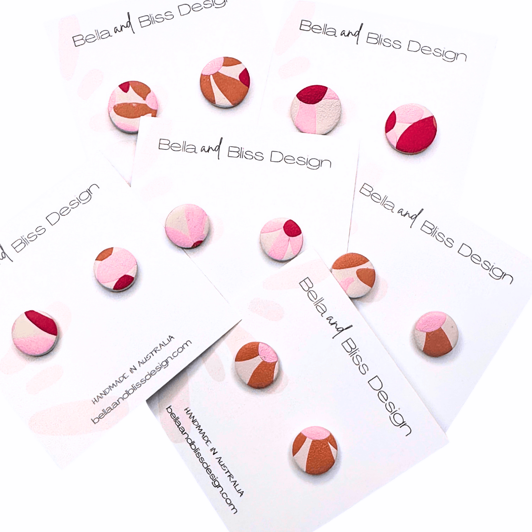 Colourful retro floral earrings on white cards with 'Bella and Bliss Design' branding.