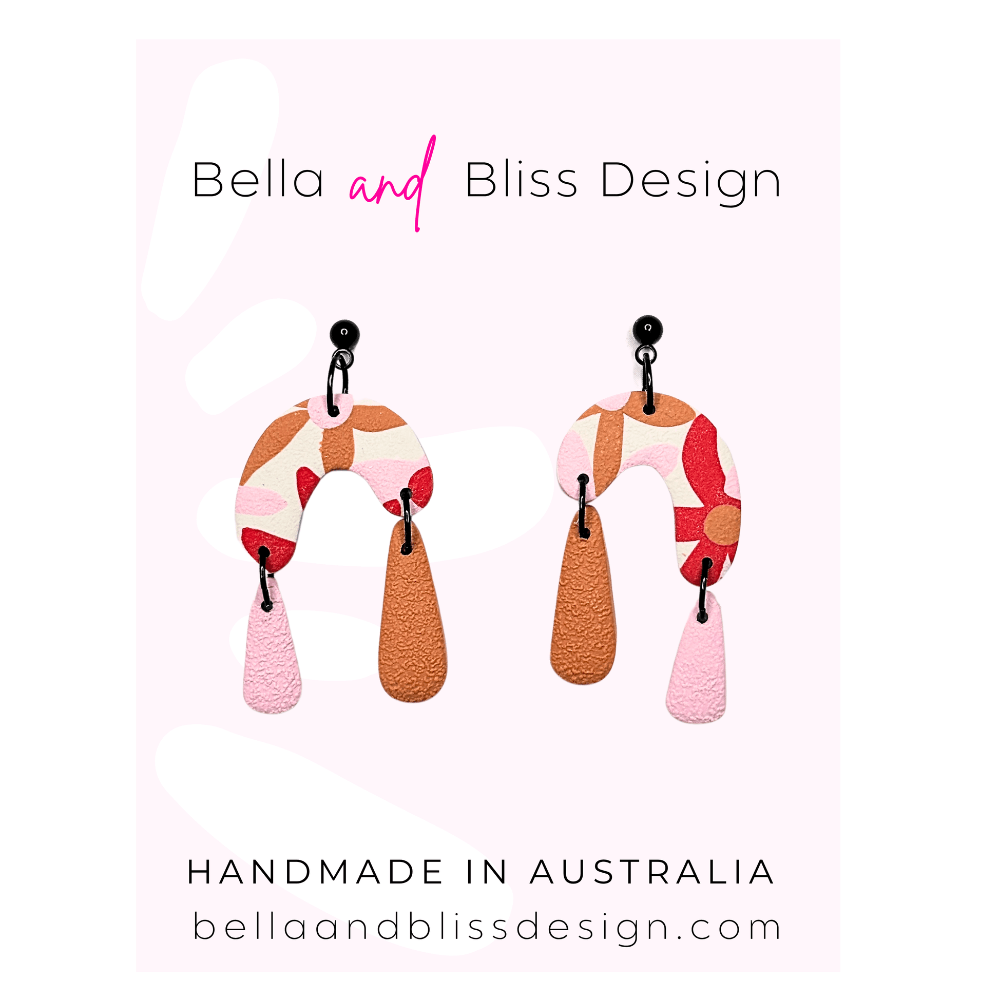 Colorful earrings with 'Bella and Bliss Design' branding on a light pink background.