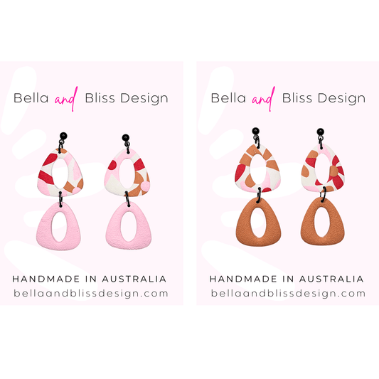 Pair of colorful earrings with 'Bella and Bliss Design' branding on a white background.