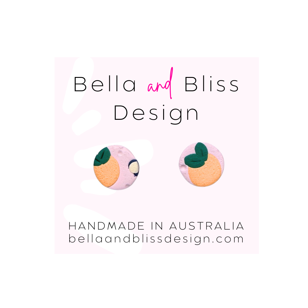 Peach Blossom Earrings with 'Bella and Bliss Design' branding on a pink background