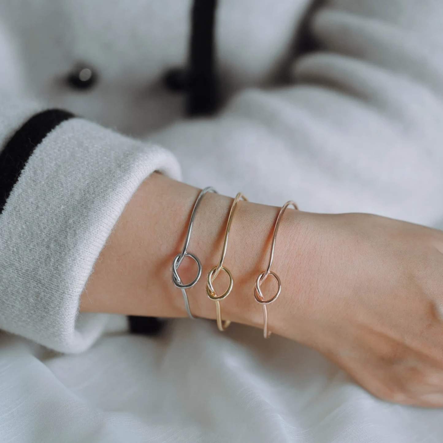 Silver, Gold, Rose Gold bangles on wrist